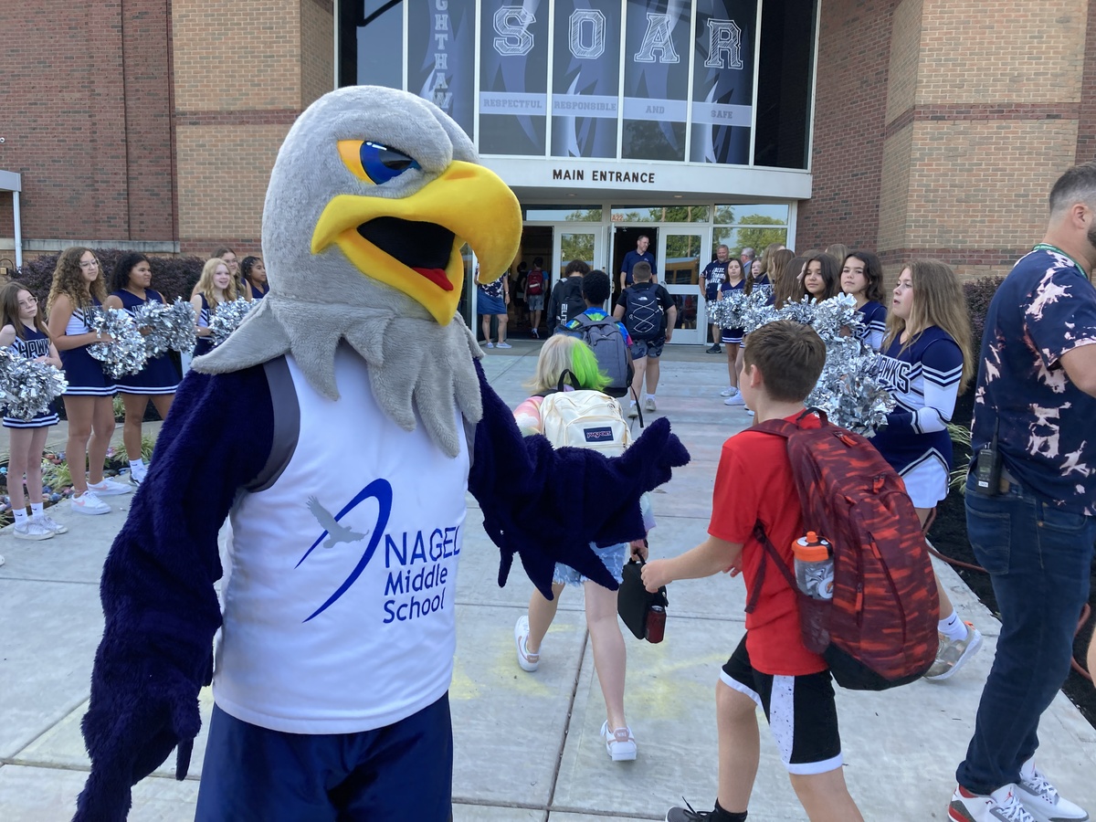 Nagel nighthawk mascot welcoming students into school
